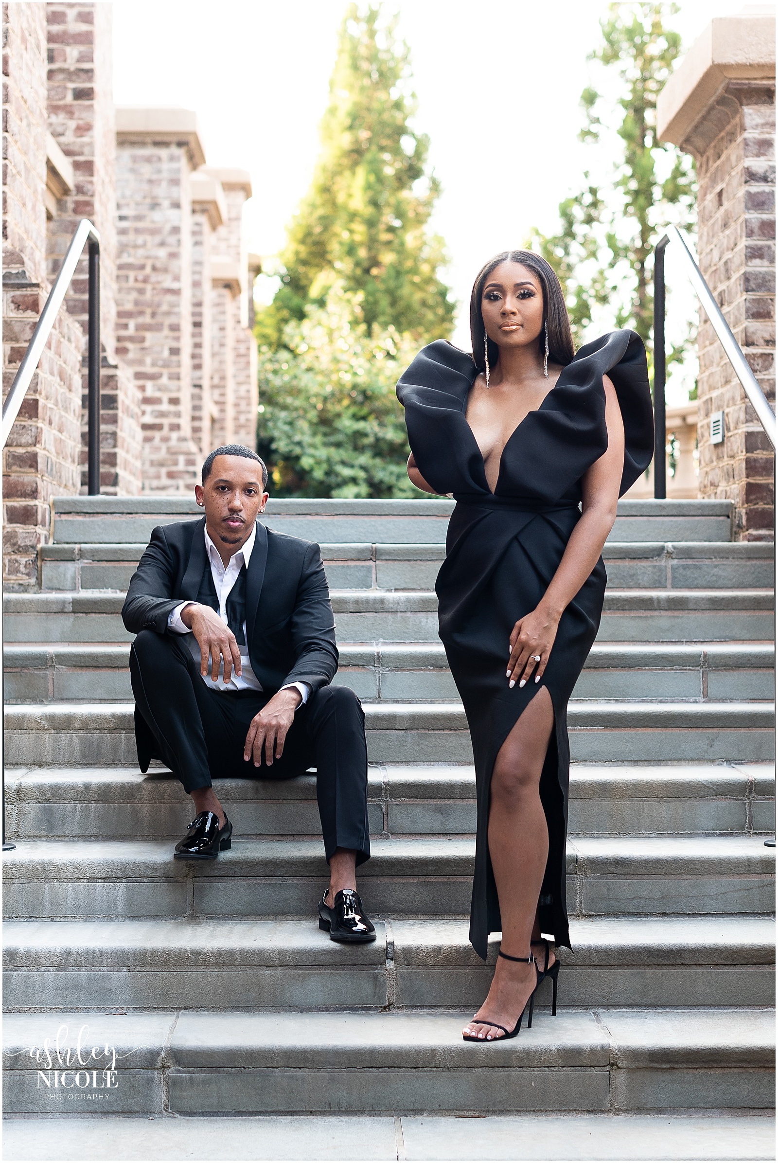 black couple sitting on steps
