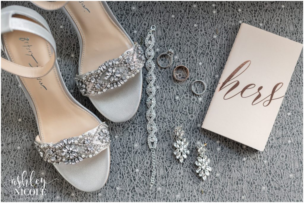 Wedding shoes jewelry and vow book