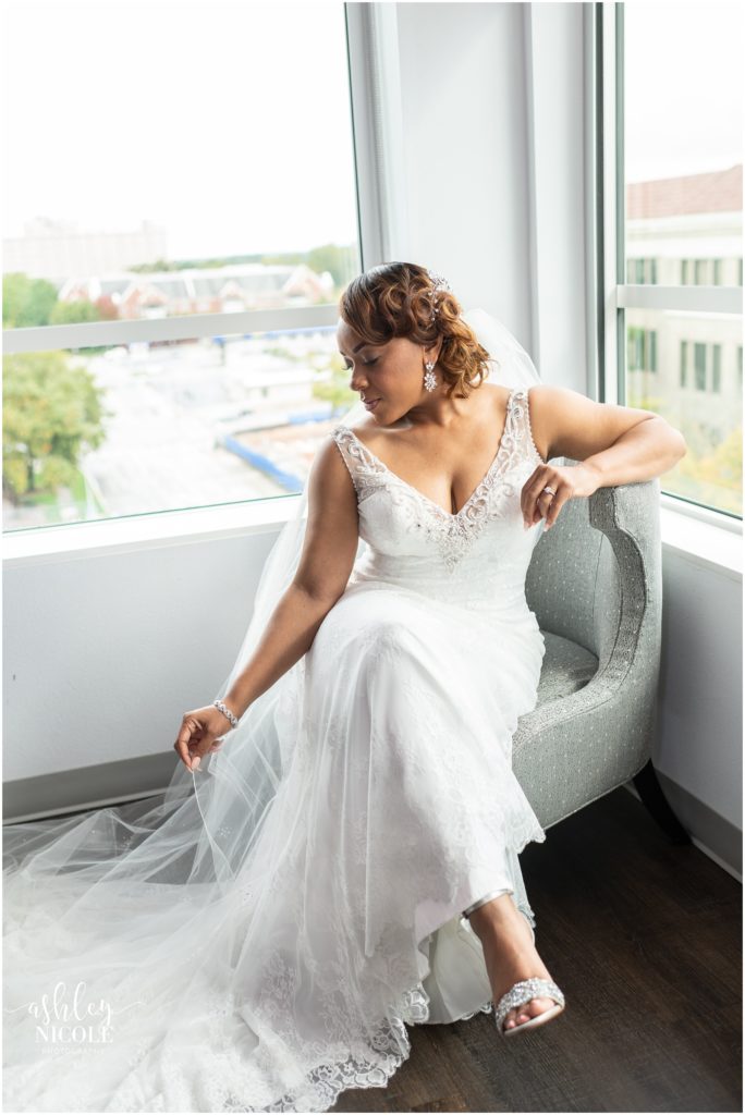 bride sitting by window