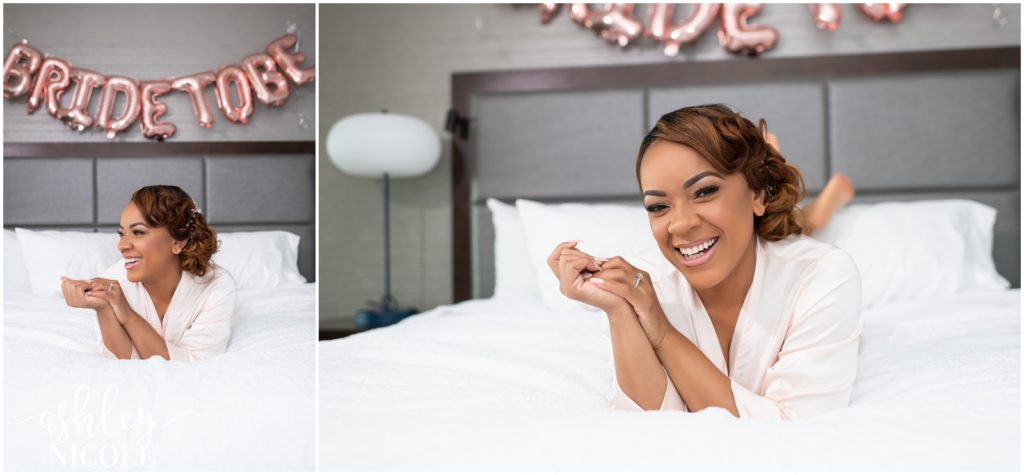 bride laughing in bed on wedding day