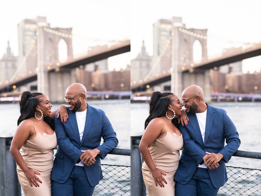 African american couple standing under Brooklyn Bridge smiling