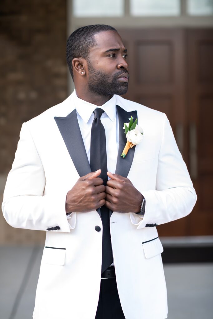 african american groom in white and black tuxedo