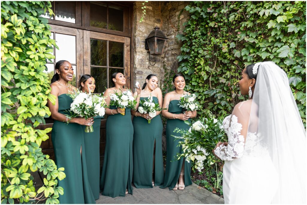brides first look with her bridesmaids