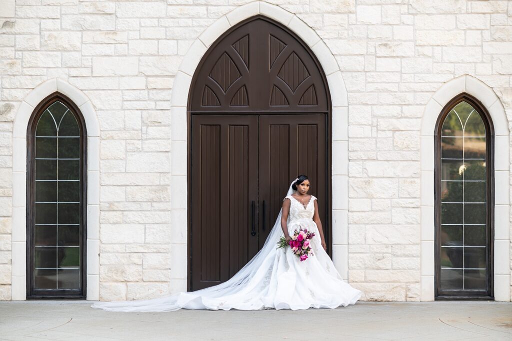 bride standing in front of ashton gardens